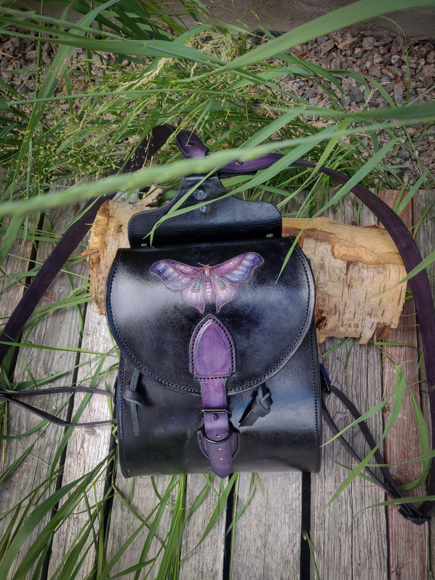 Leather backpack with moth design