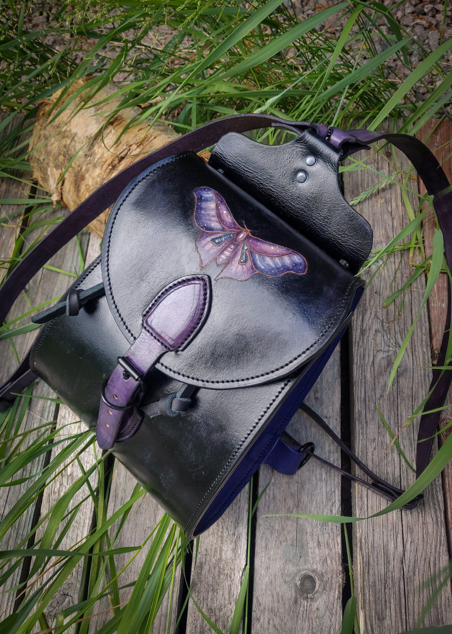 Leather backpack with moth design
