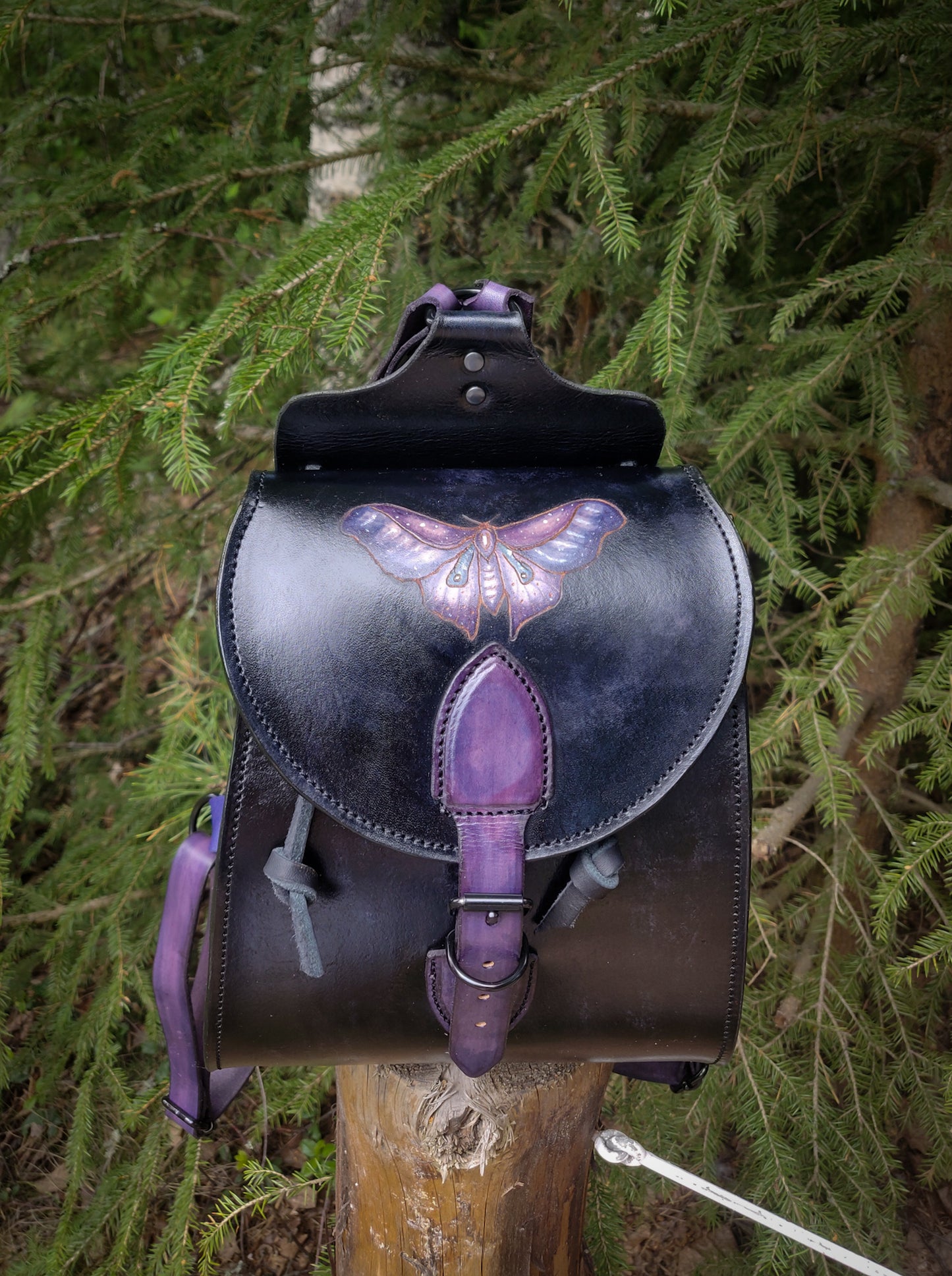 Leather backpack with moth design